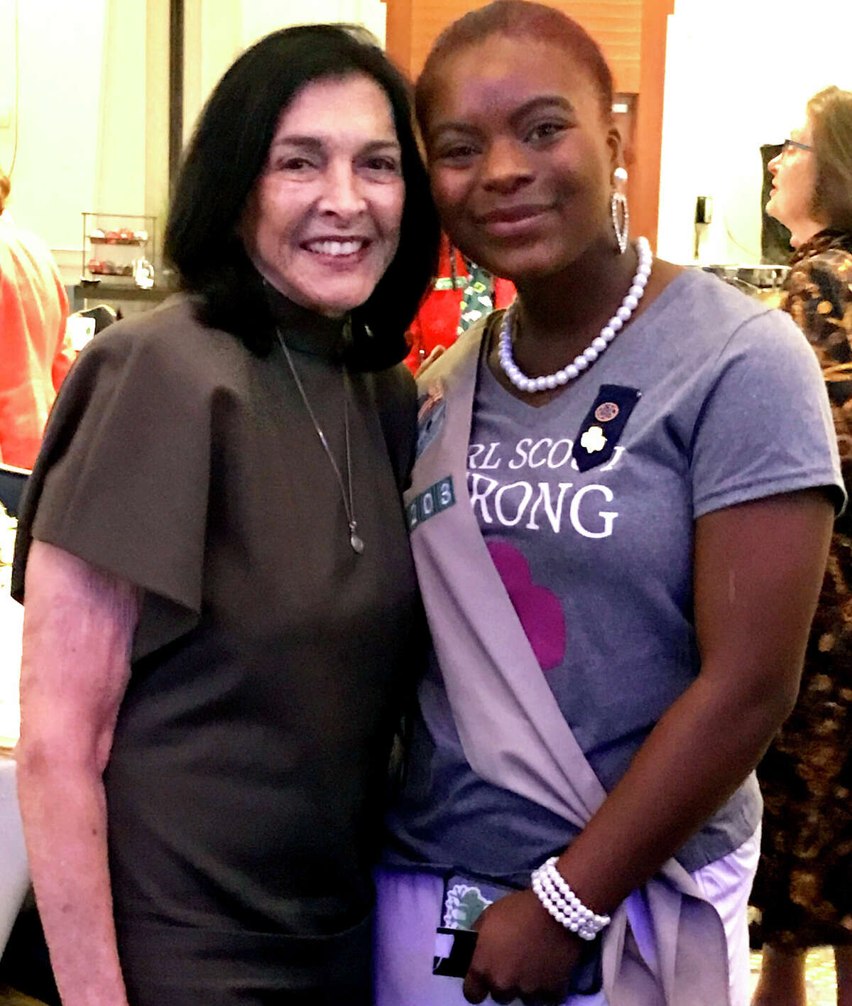 Francine Farkas SEars at Dec. 8 Girl Scouts of Connecticut Women Who Shine awards breakfast in Hartford with Girl Scout Nakia Dennis.