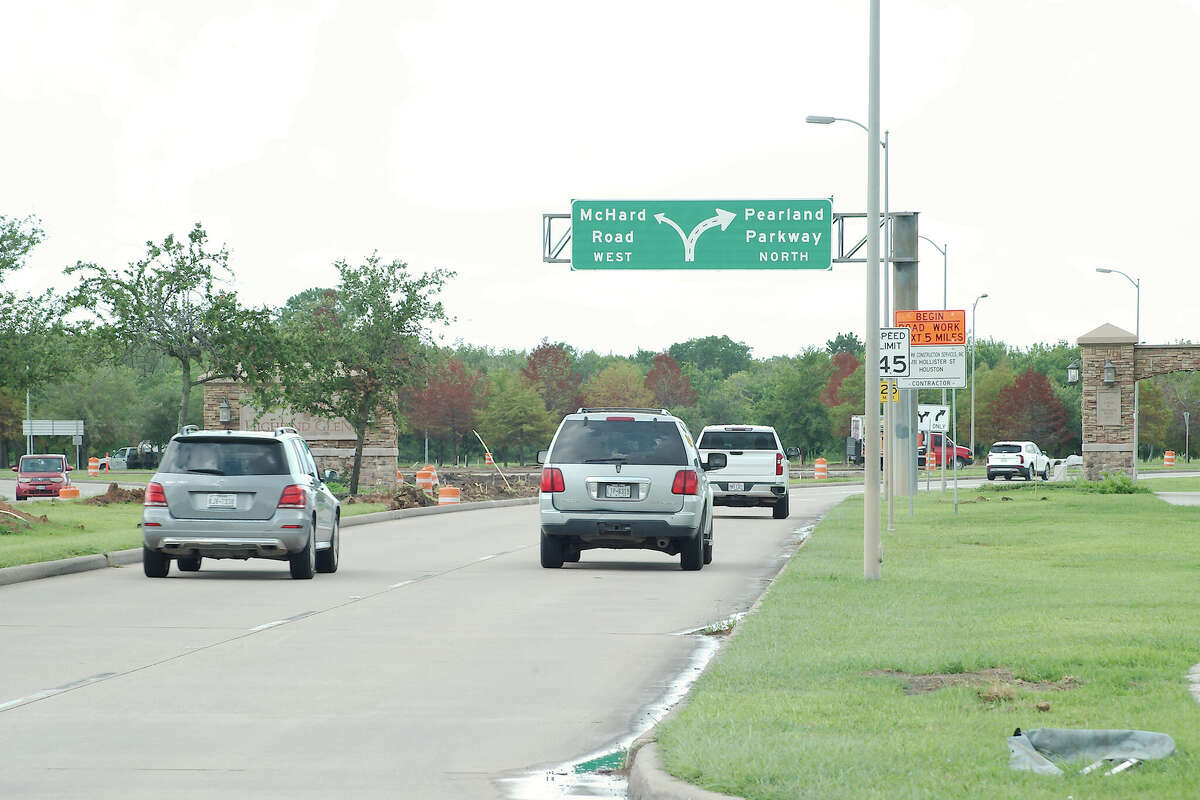 Vehicles travel north on Pearland Parkway as they approach the roundabut at McHard Road in Pearland.