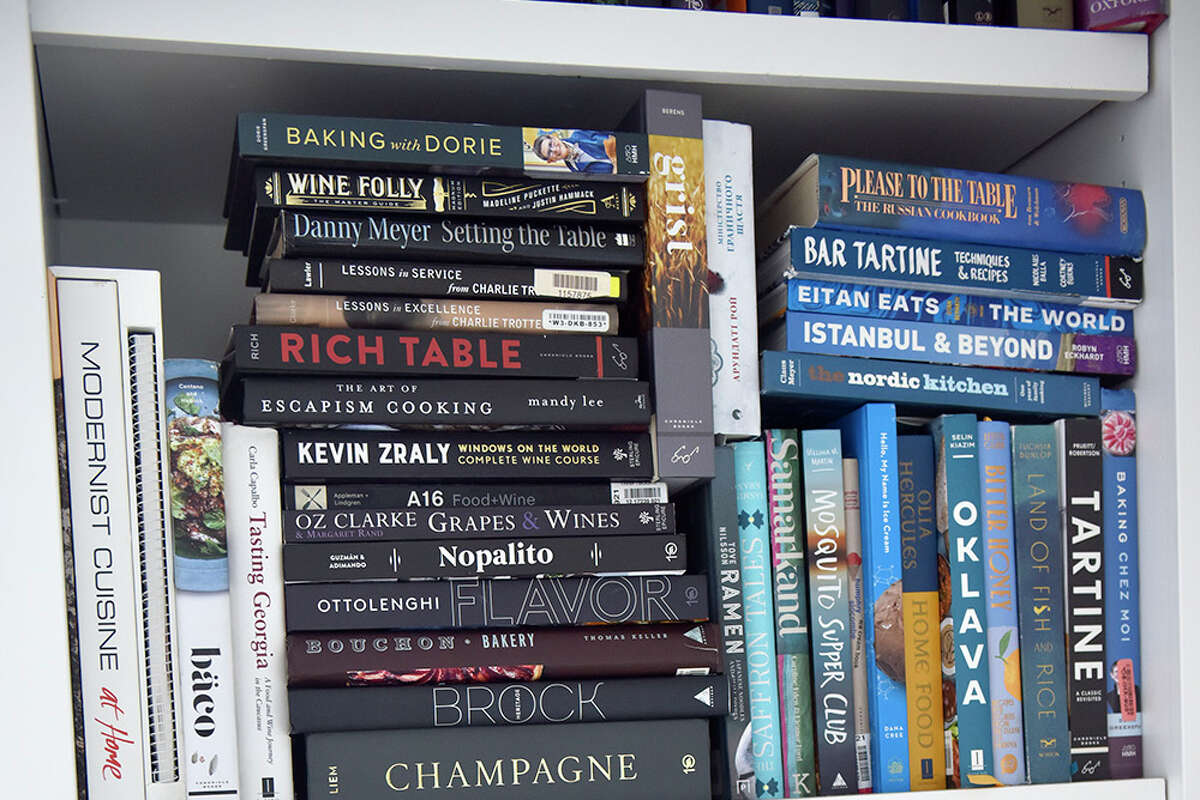 Some of the many cookbooks inside chef Anna Voloshnya's apartment.