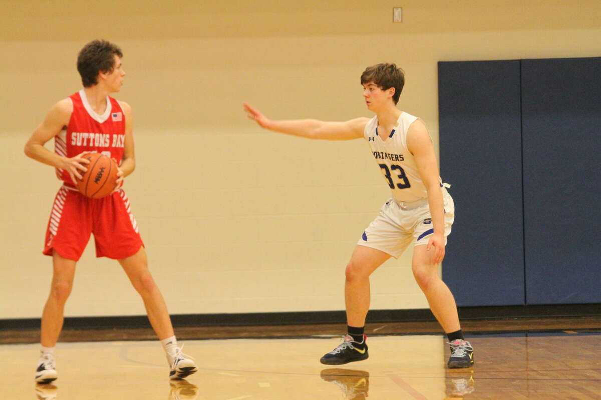 Onekama sophomore Arden Bradford (right) defends against Suttons Bay on Dec. 16. 