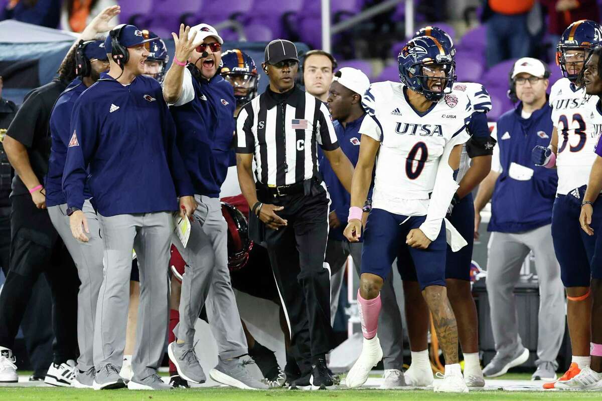 ORLANDO, FLORIDA - DECEMBER 16: Frank Harris #0 and head coach Jeff Traylor of the UTSA Roadrunners react against the Troy Trojans during the fourth quarter of the Duluth Trading Cure Bowl at Exploria Stadium on December 16, 2022 in Orlando, Florida. (Photo by Douglas P. DeFelice/Getty Images)
