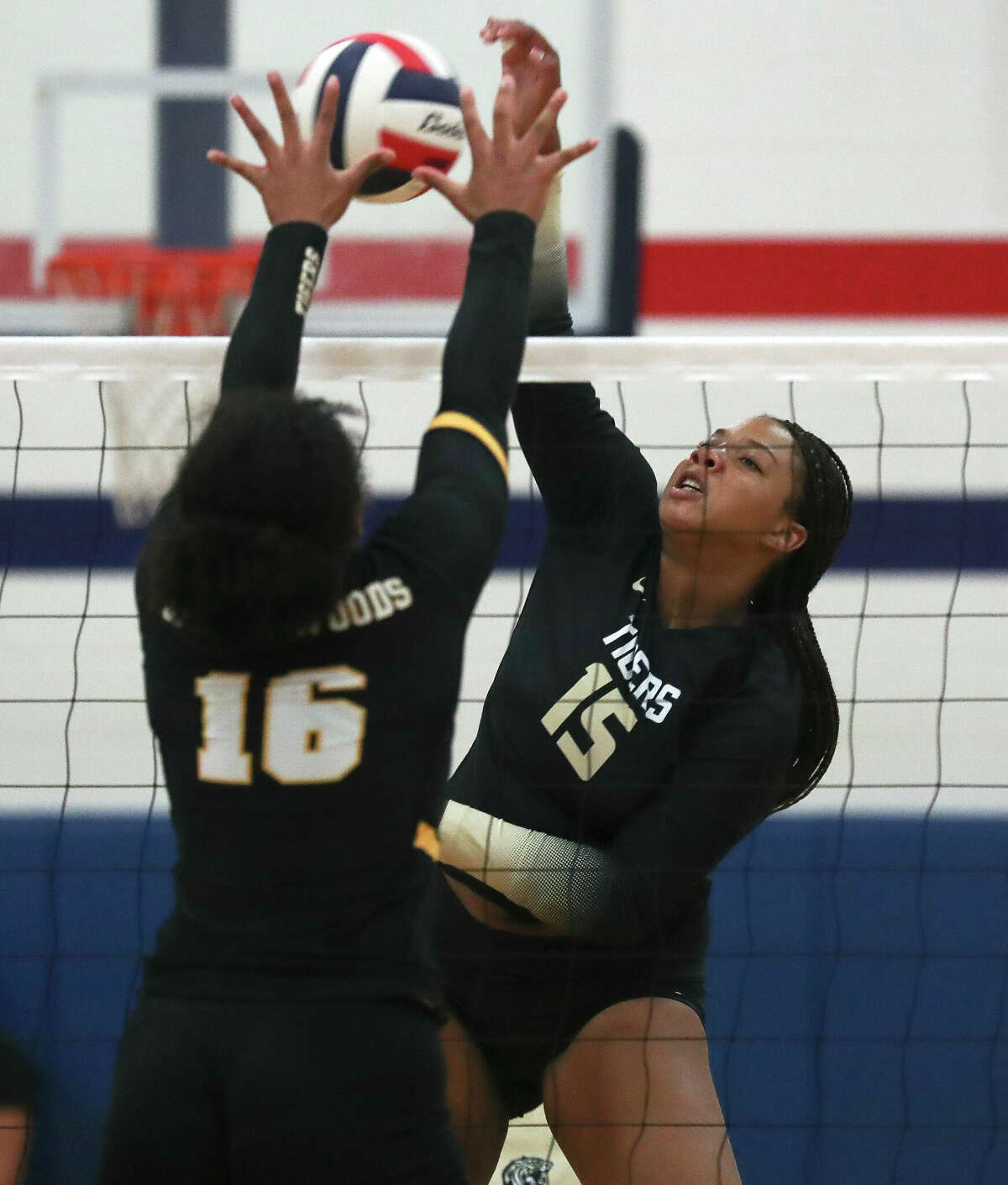 Conroe's Ariana Brown (15) scores a point in the first set of a non-district high school volleyball match, Thursday, Aug. 18, 2022, in Houston.