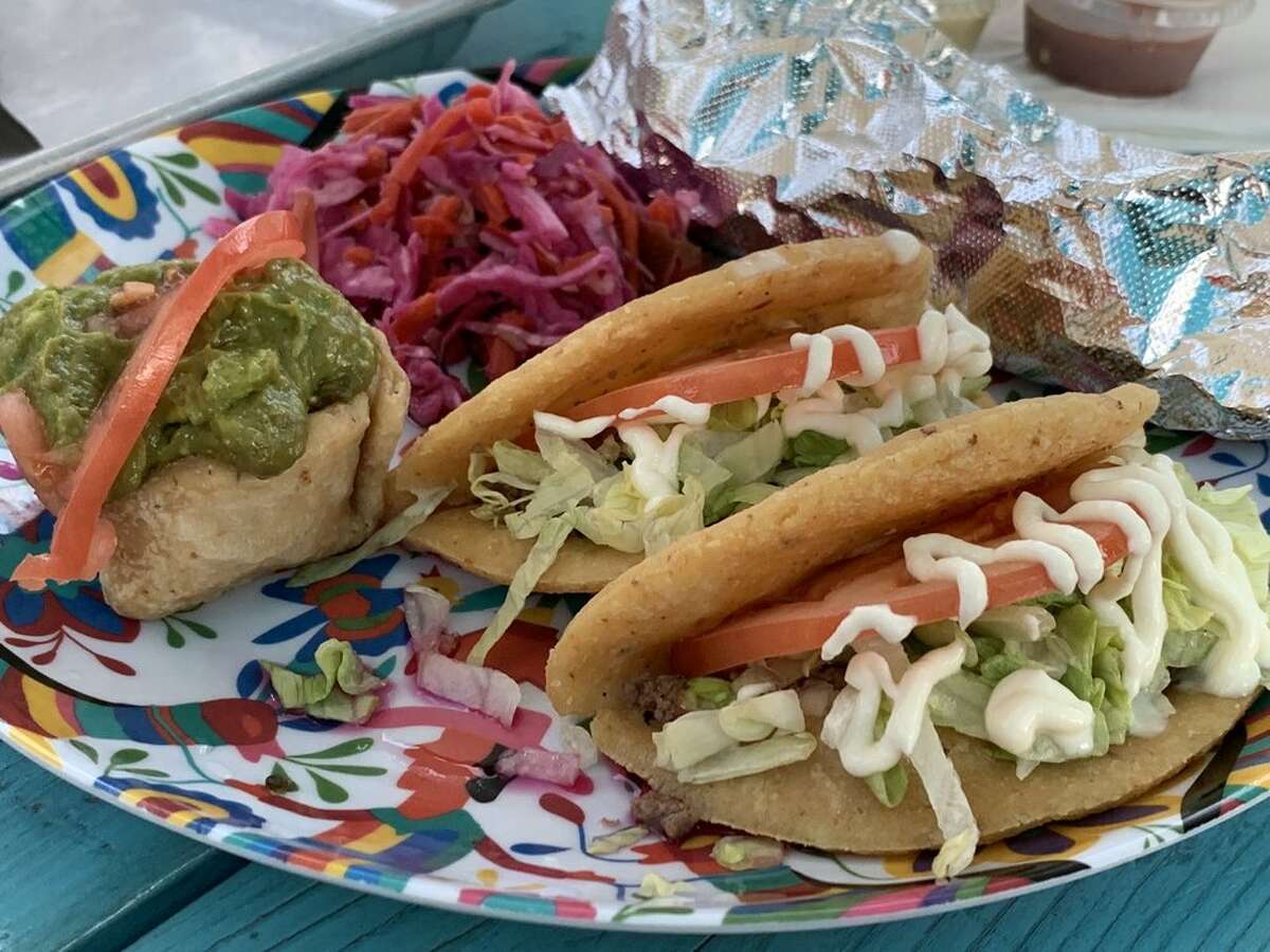 A plate of puffy tacos from Lala's Gorditas in San Antonio. The dish is seen as emblematic of the city's Tex-Mex-heavy food scene.