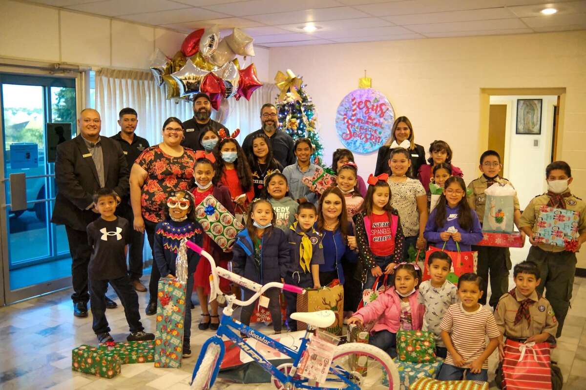 Kids at the Sacred Heart Children's Home received gifts this holiday season from the staff of Embassy Suites.
