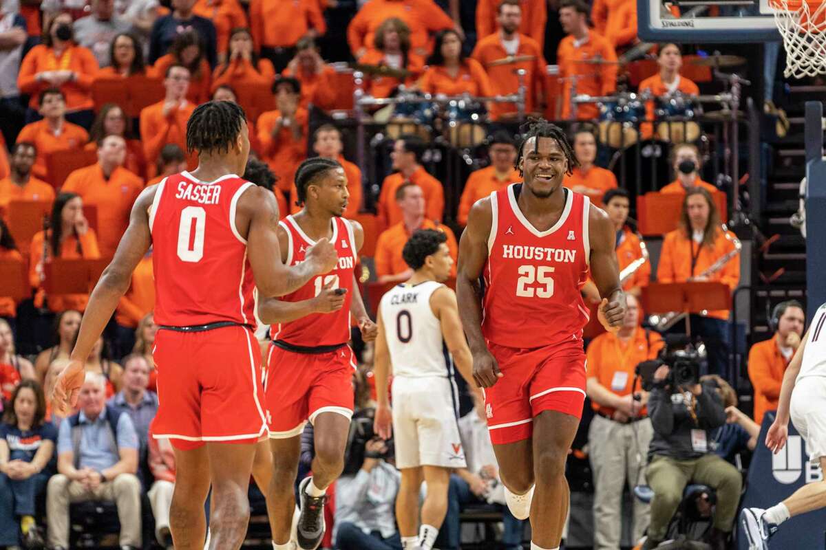 UH's Marcus Sasser (0), Tramon Mark (12) and Jarace Walker (25) weathered a raucous atmosphere at Charlottesville as the Cougars vanquished Virginia in December. 