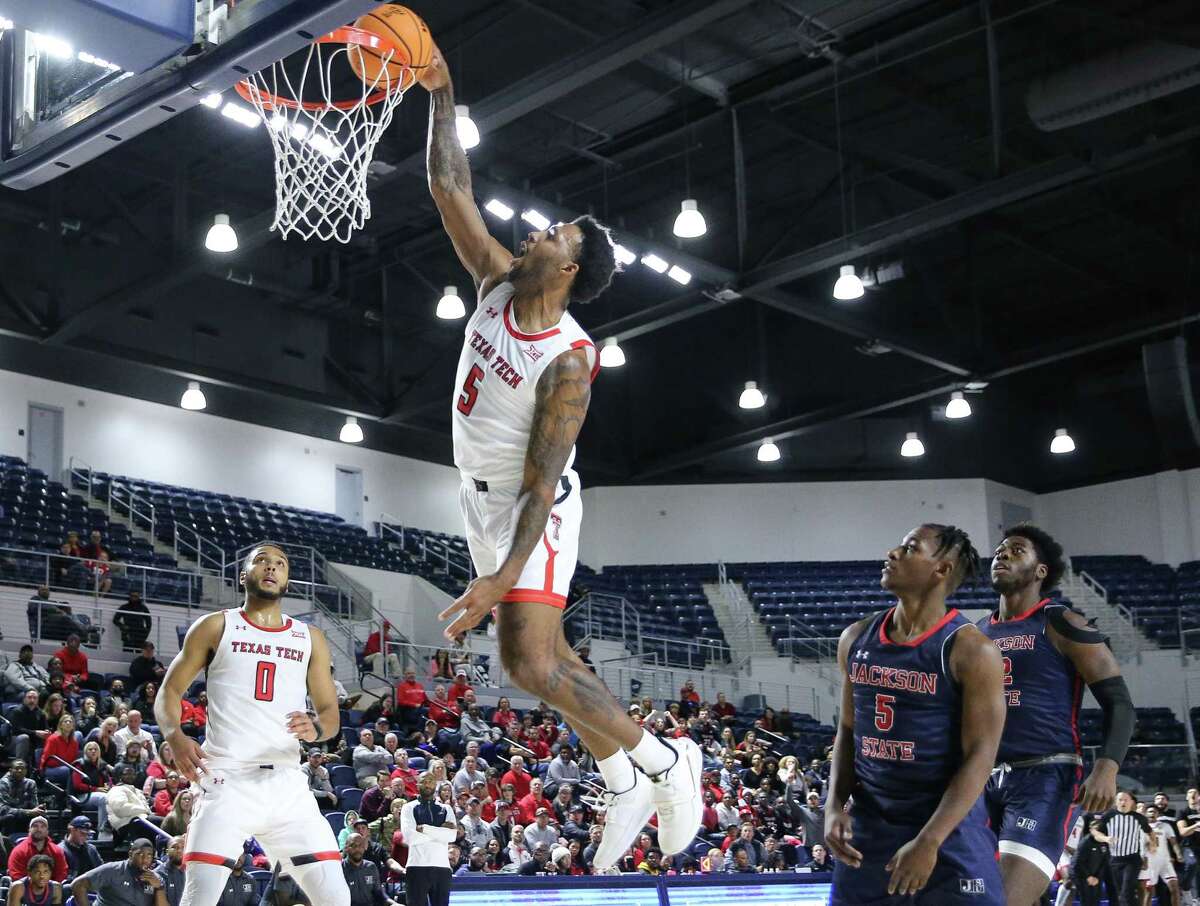Texas Tech Red Raiders forward KJ Allen (5) goes for a monster dunk during the first half of HBCU Roundball Classic hosted by Coaches Vs. Racism game against the Jackson State Tigers Saturday, Dec. 17, 2022, at Delmar Field House in Houston.
