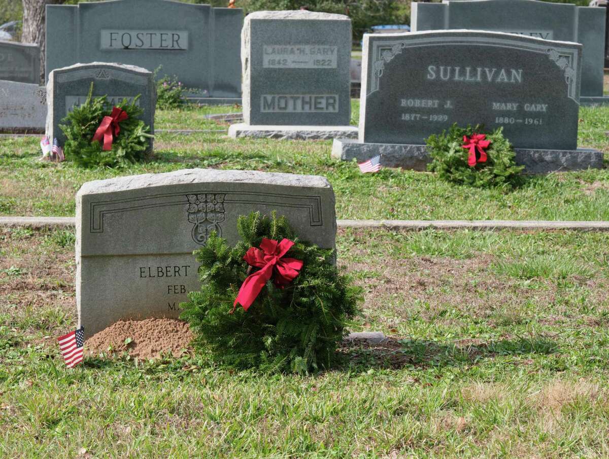  Some wreaths on the grave of veterans on Saturday during Wreaths Across America at Oak Wood Cemetery in Conroe.