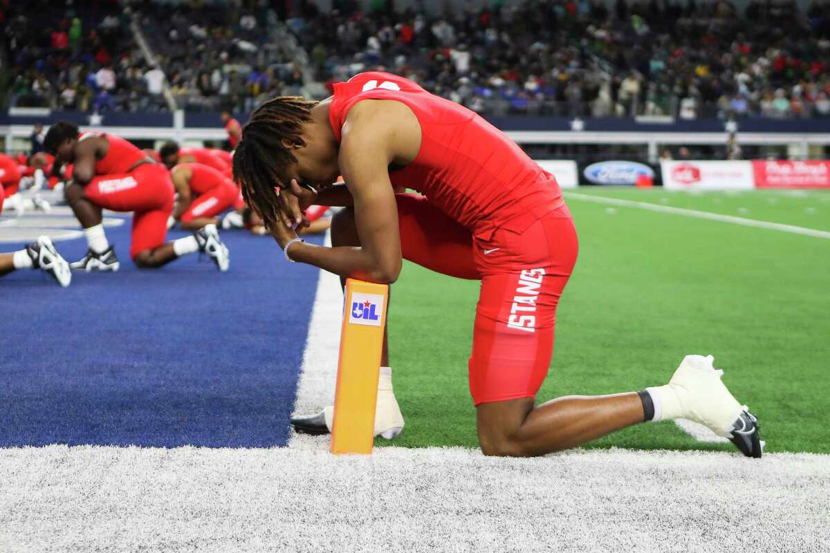 North Shore defensive back Devin Sanchez (6) takes a moment before the Class 6A Division I football state championship at AT&T Stadium, Saturday, Dec. 17, 2022, in Arlington.