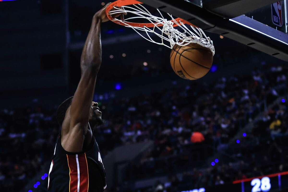 Bam Adebayo of the Miami Heat dunks against the Spurs at Arena Ciudad de Mexico on Saturday in Mexico City.