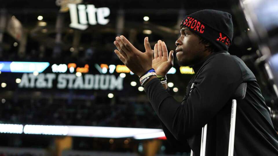 North Shore injured quarterback Kaleb Bailey cheers on his team during the Class 6A Division I football state championship at AT&T Stadium, Saturday, Dec. 17, 2022, in Arlington.