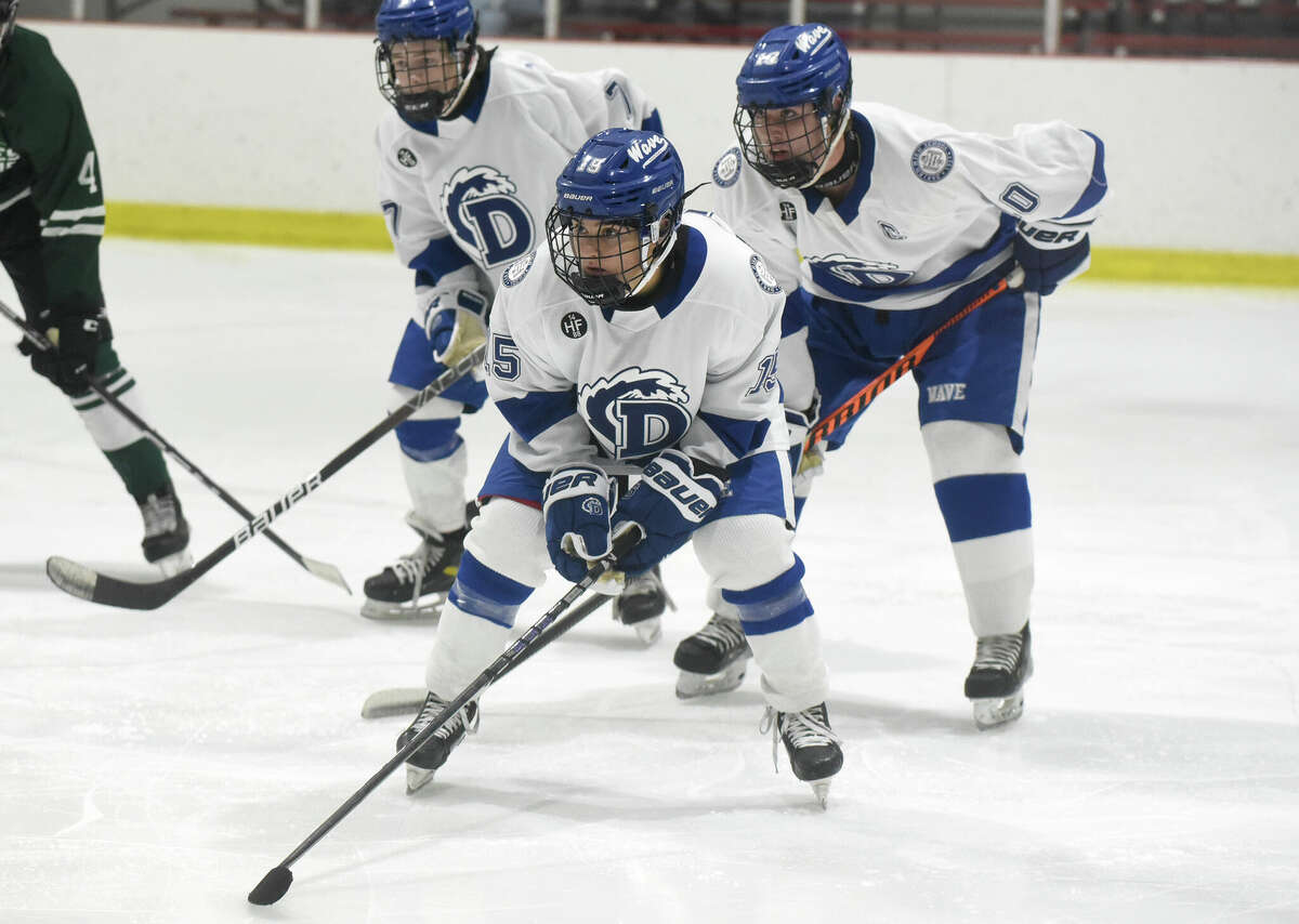 Darien defeated Northwest Catholic in boys ice hockey