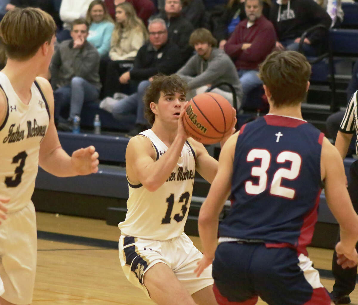 Evan Schrage attempts a three-pointer against Gibault Catholic in a non-conference matchup on Saturday in Glen Carbon. Schrage made three three-pointers in the final minute of the Griffins' 54-52 loss. 