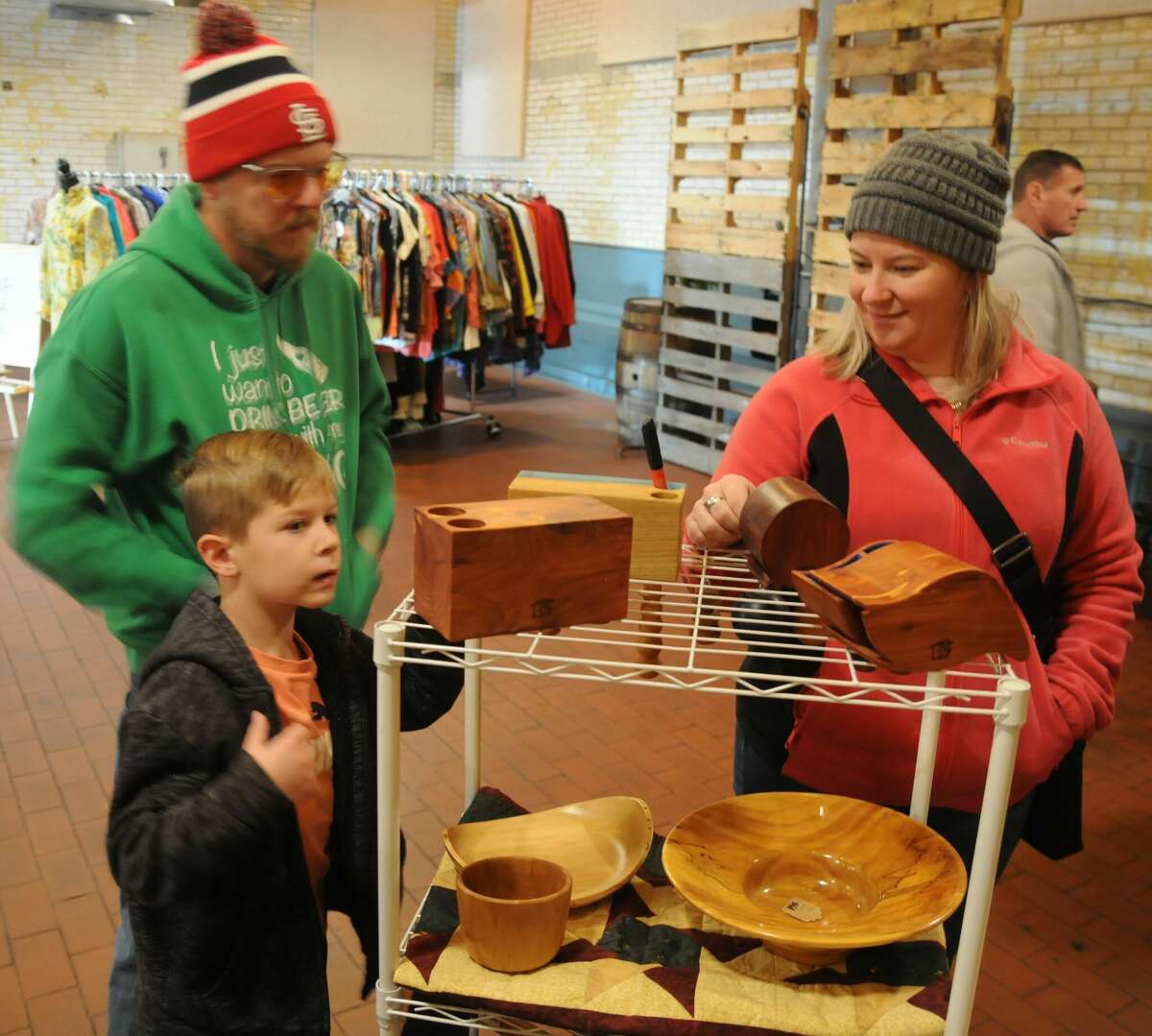 Brittany Biver and son Declan admire the hand-made products at Old Bakery Beer Co. during Saturday's Holiday Cheers Market in Alton.