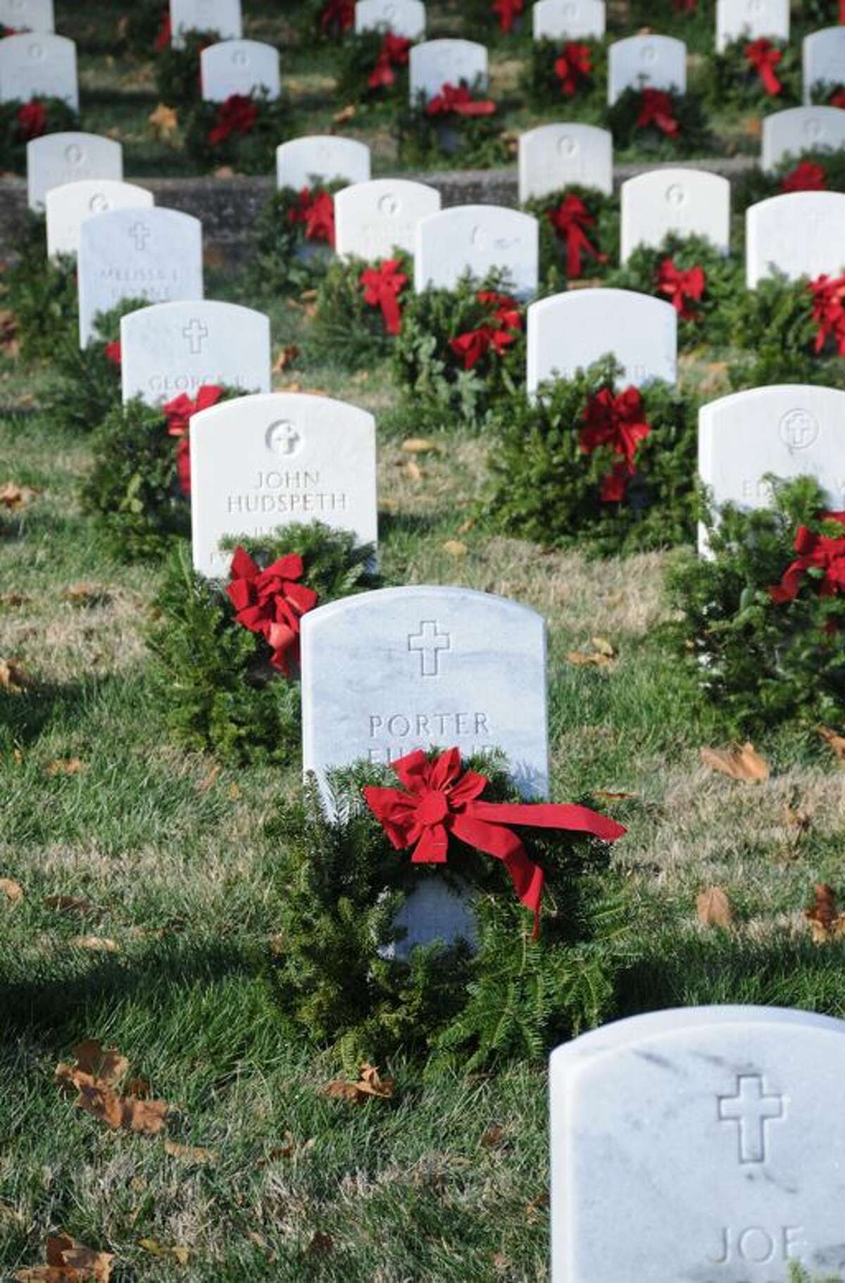 Wreaths placed during Saturday's ceremony adorn the graves at Alton National Cemetery.