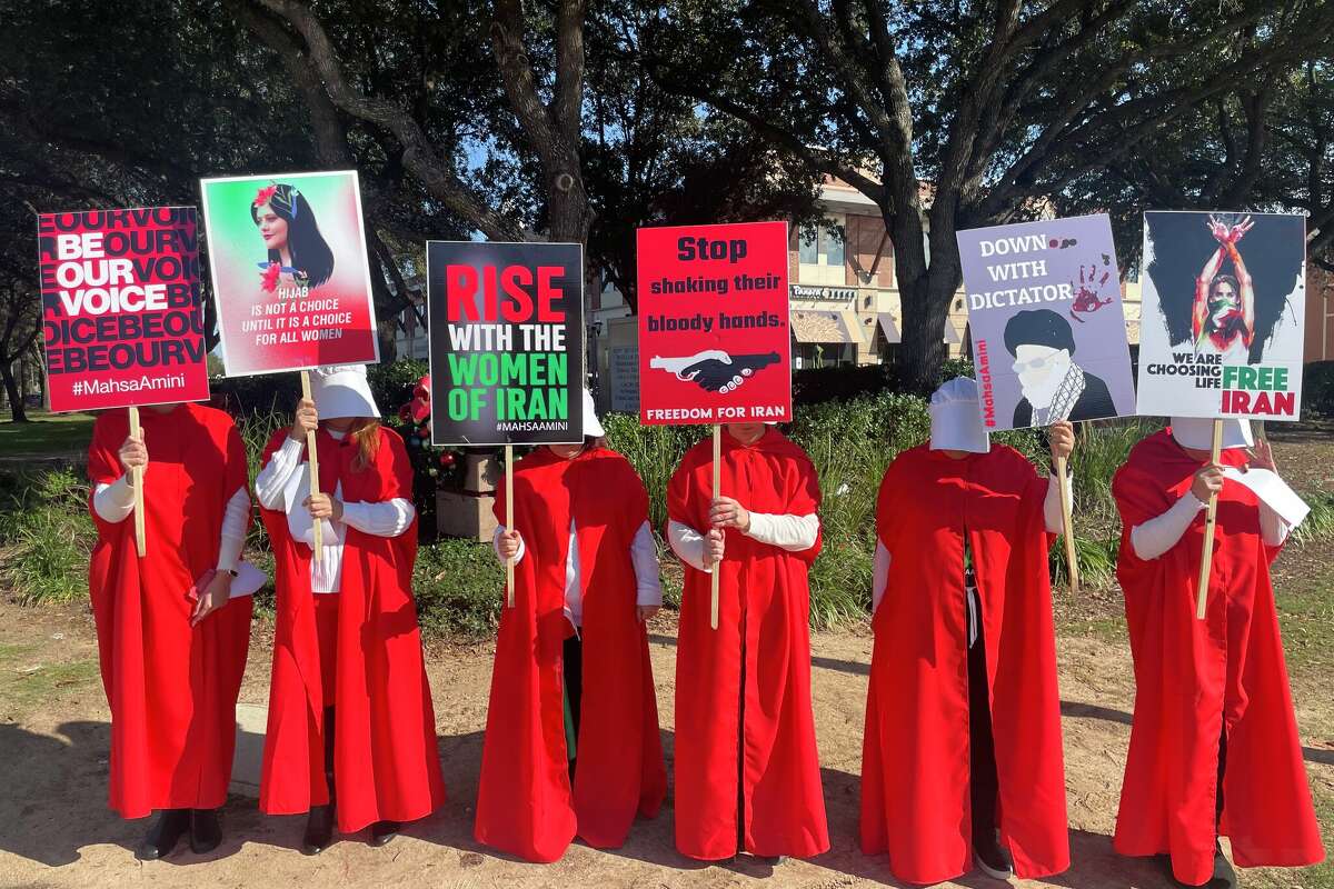 Story photo for Protesters in LaCenterra with 'Handmaid's Tale' garb decried the violence in Iran.