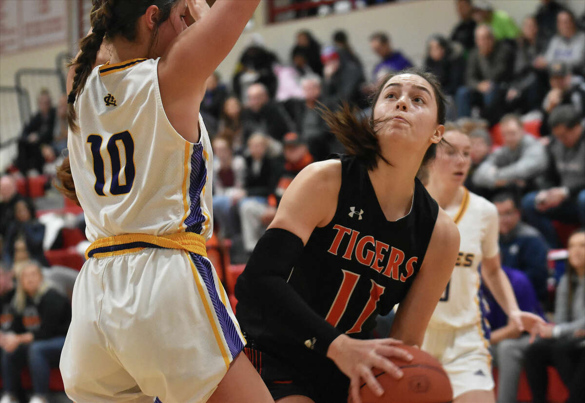 Edwardsville's Kaitlyn Morningstar looks for shooting room against Civic Memorial's Meredith Brueckner on Saturday in the first round of the Visitation Christmas Tournament in St. Louis.