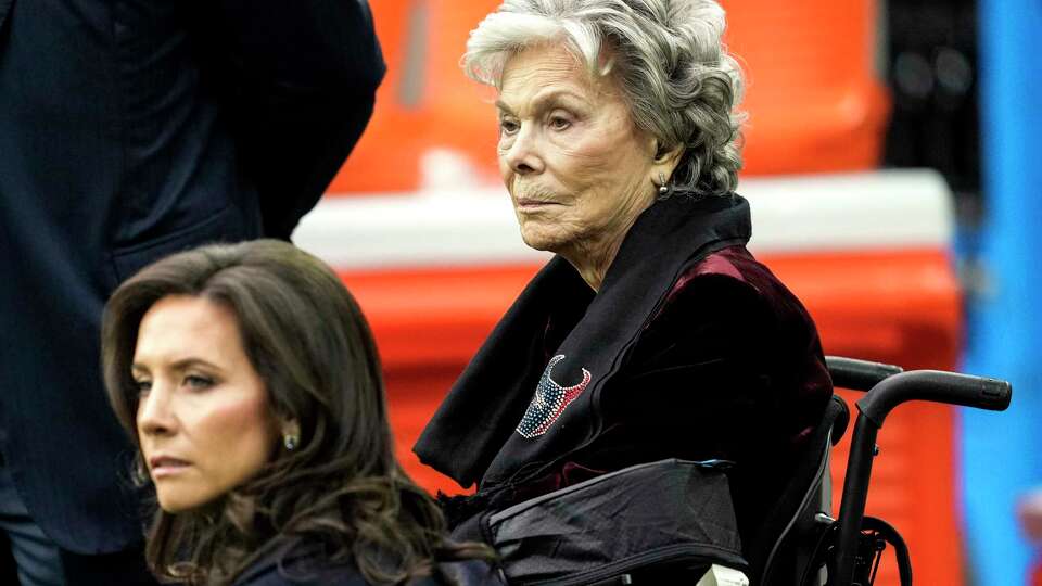 Houston Texans co-founder Janice McNair sits on the sidelines with her daughter-in-law, Hannah McNair, before an NFL football game against the Kansas City Chiefs Sunday, Dec. 18, 2022, in Houston.