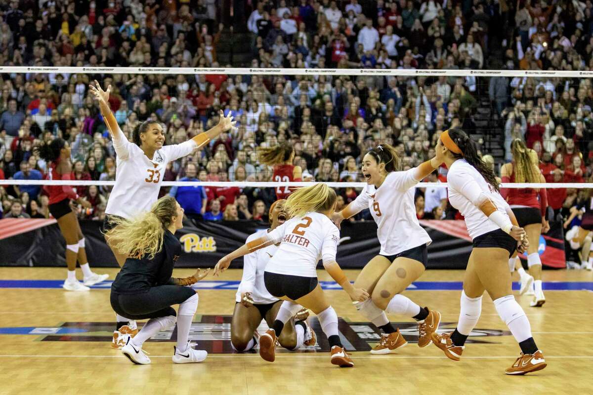 Texas celebrates a win over Louisville in the third set during the NCAA college volleyball championship finals, Saturday, Dec. 17, 2022, in Omaha, Neb. (AP Photo/John S. Peterson)