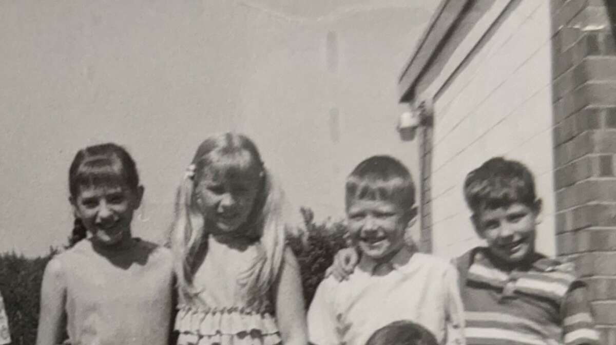 Four of my second-graders for the school year 1967-1968: (from left) Judy Cook, Sandy Keblebeck, Joel Holzhausen and Greg Roebuck.  In the lunch line a third-grader got mixed up with the second-graders. Greg said, “I’m one of hers.”  And the words went down the entire line of second graders. They were mine. Every one of them.