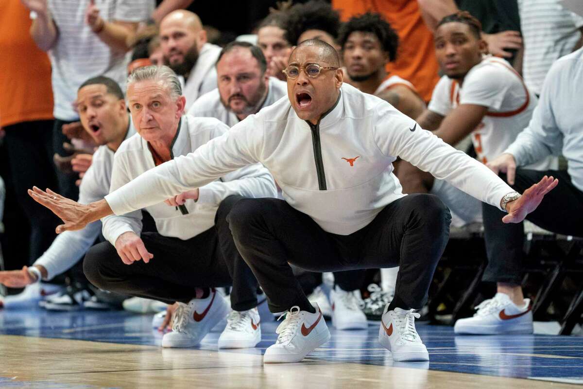 Texas acting head coach Rodney Terry gestures to his team during the second half of Sunday’s game against Stanford in Dallas.