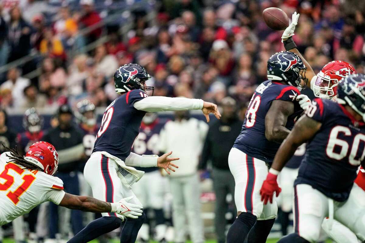 Houston Texans quarterback Davis Mills (10) has a pass knocked down by a Kansas City Chiefs defender during the second half an NFL football game Sunday, Dec. 18, 2022, in Houston.