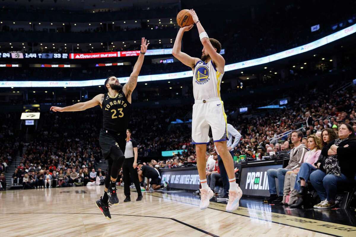 TORONTO, ON - DECEMBER 18: Klay Thompson #11 of the Golden State Warriors puts up a shot over Fred VanVleet #23 of the Toronto Raptors during the first half of their NBA game at Scotiabank Arena on December 18, 2022 in Toronto, Canada. NOTE TO USER: User expressly acknowledges and agrees that, by downloading and or using this photograph, User is consenting to the terms and conditions of the Getty Images License Agreement. (Photo by Cole Burston/Getty Images)