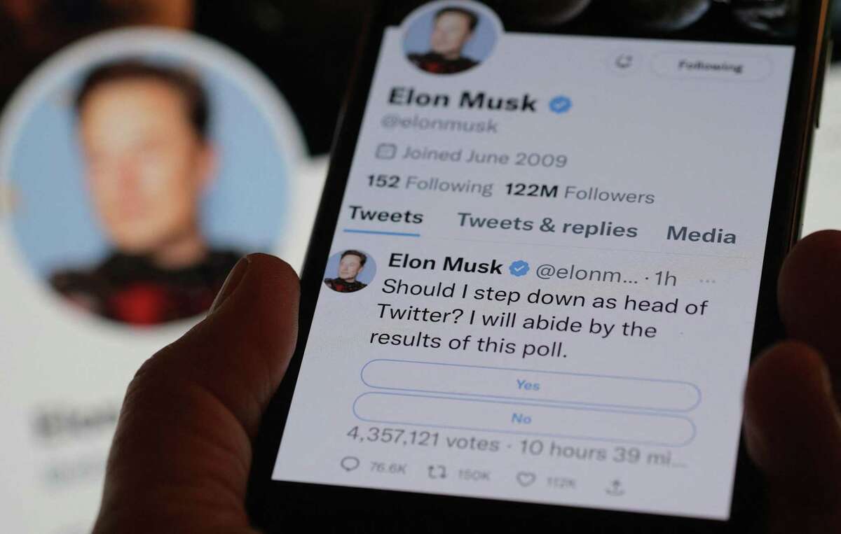 This photo illustration taken on Sunday, Dec. 18, 2022, in Los Angeles shows a phone displaying Elon Musk's Twitter page, where he is conducting a survey about his future as the head of the company. (Chris Delmas/AFP/Getty Images/TNS)