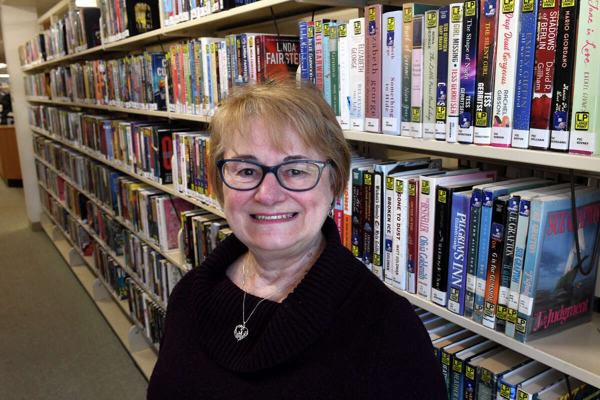 Marcia Austin, director of the Huntington Branch Library in Shelton, Conn. Dec. 19, 2022.