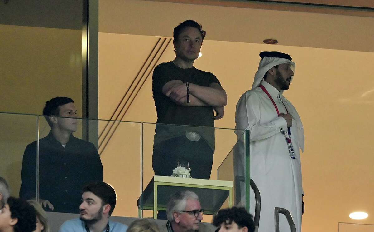 Elon Musk, center, watches the 2022 FIFA World Cup final match between Argentina and France on Dec. 18 at Lusail Stadium in Qatar along with Jared Kushner, left.