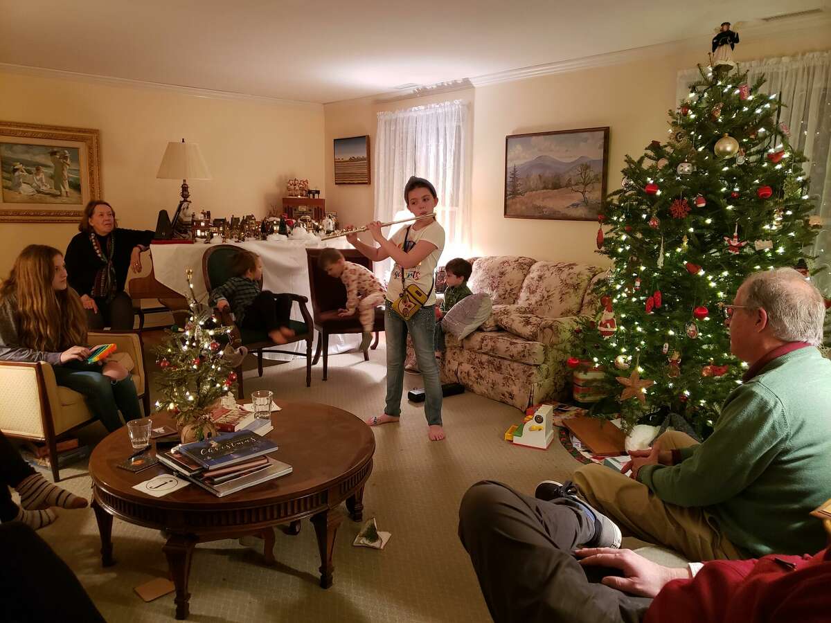 Frank Whitman's family gathers for an evening of Christmas music. 