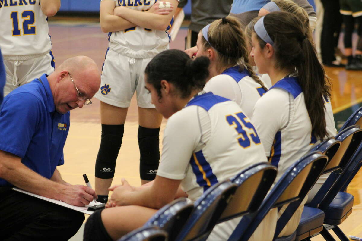 Coach Tim Kohs addresses his Mercy girls basketball team during a game against Holy Cross to open the 2022-23 season.