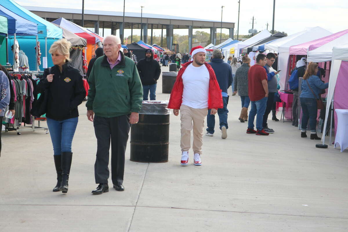 Pasadena City Council member Don Harrison and daughter Renee Harrison strolled the flea market grounds looking for Christmas gift ideas Saturday.