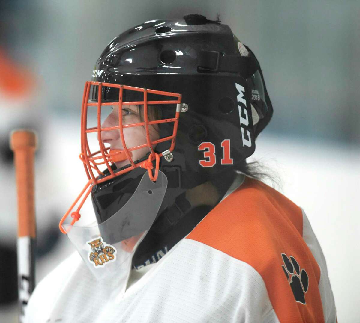 CT hockey goalie keeps singing national anthem when mic fails.