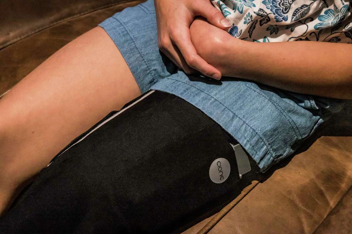 Sophia Robison, 13, wears Cionic leg sleeves designed by her father, Cionic founder Jeremiah Robison. Rukov stimulates the muscles to help her walk.