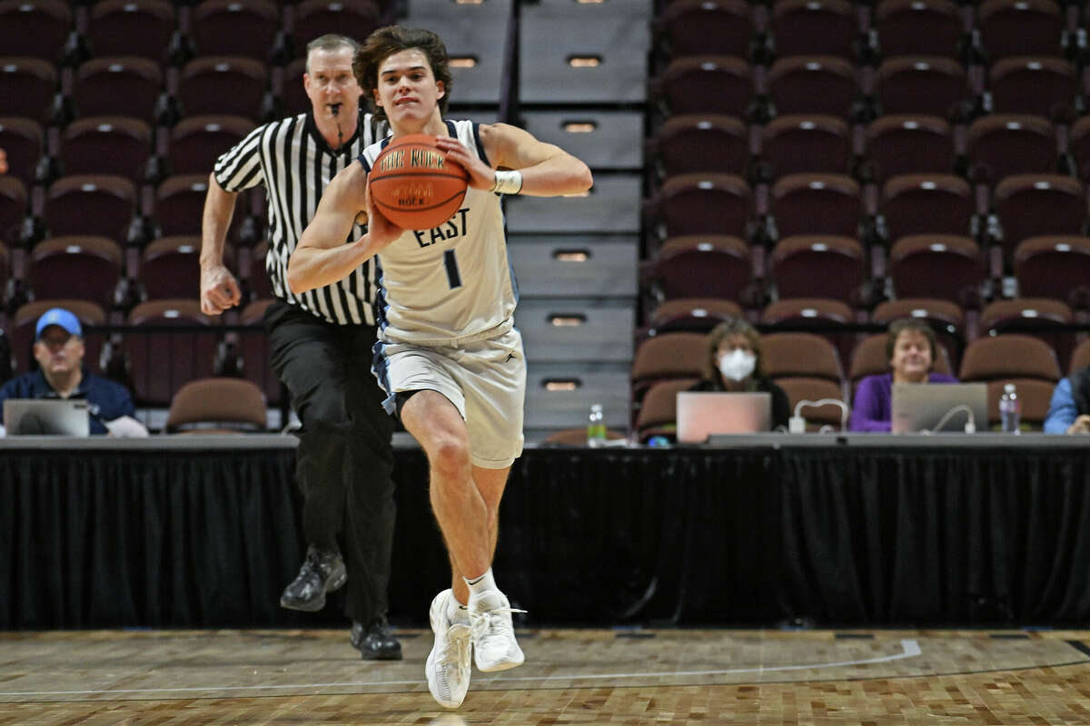 East Catholic guard Luke Reilly (1) launches a pass down courts against Notre Dame in non-league boys high school basketball action Monday, December 19, 2022 at Mohegan Sun Arena. East Catholic came back in the second half for the 62-50 win. (Sean D. Elliot/Special to GameTimeCT)