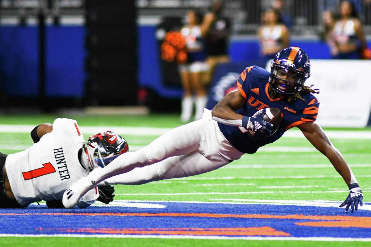 UTSA wide receiver Joshua Cephus dives for a first down during the 2021 Conference USA championship game against Western Kentucky at the Alamodome. UTSA won, 49-41.