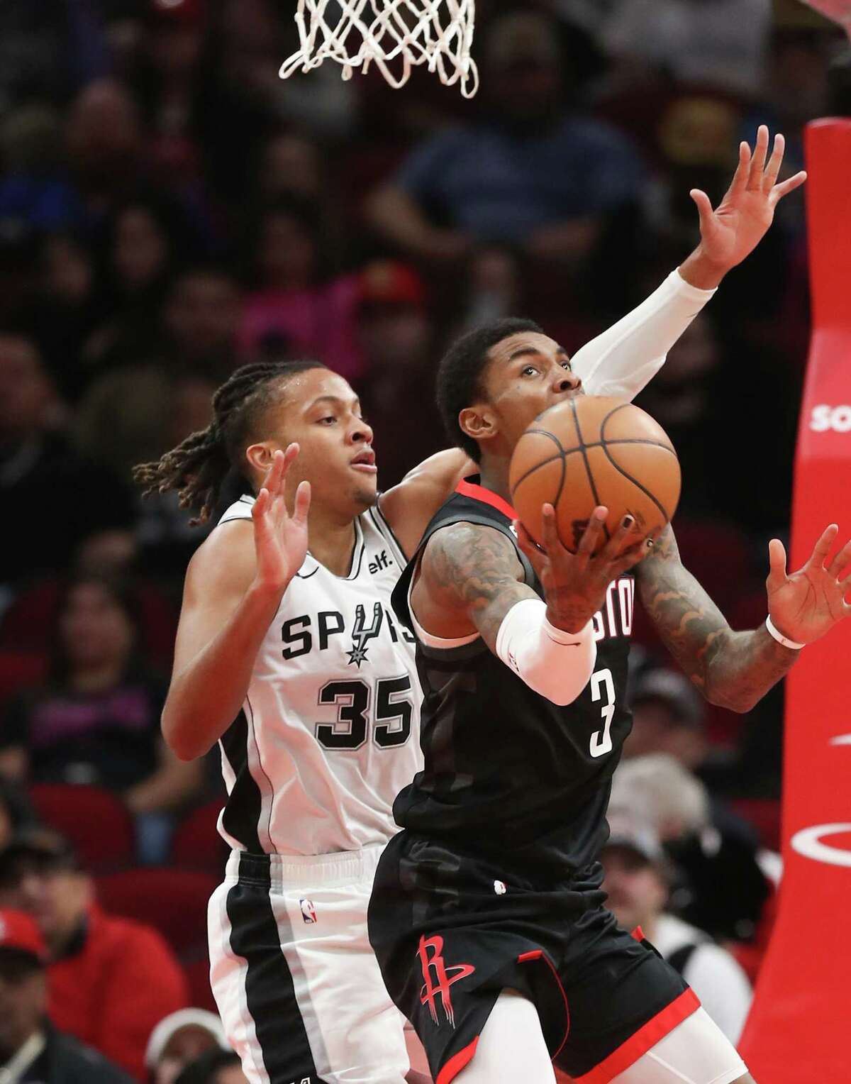 Houston Rockets guard Kevin Porter Jr. (3) looks to the basket against San Antonio Spurs guard Romeo Langford (35) in the second half at the Toyota Center on Monday, Dec. 19, 2022 in Houston. San Antonio Spurs won the game 124-105.