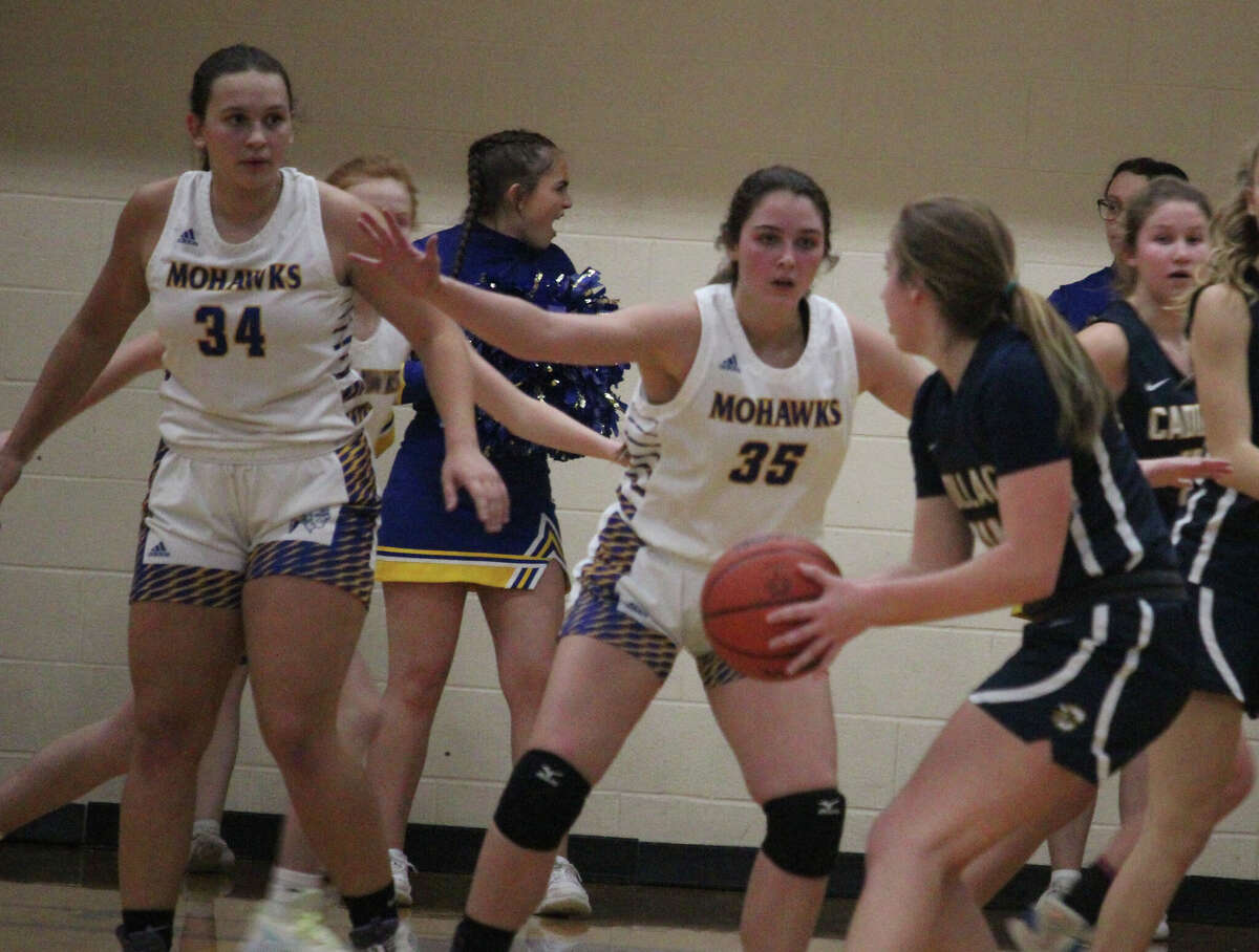 Morley Stanwood's MaKenna Martin (34) and Dakota Thompson (35) apply the defensive pressure against Cadillac on Monday.