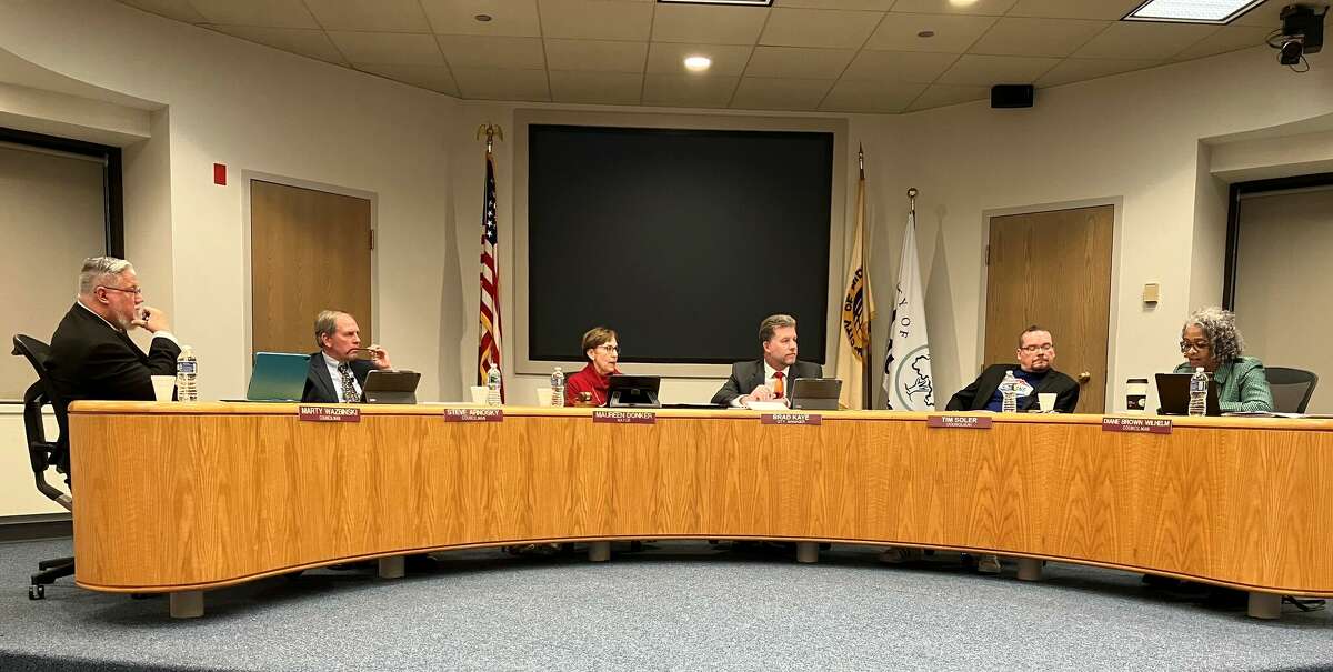 From left, Midland City Council members Marty Wazbinski, Steve Arnosky and Mayor Maureen Donker; City Manager Brad Kaye; and City Council members Tim Soler and Diane Brown Wilhelm discuss the future of Ashman and Rodd streets in a meeting at City Hall on Dec. 19, 2022.