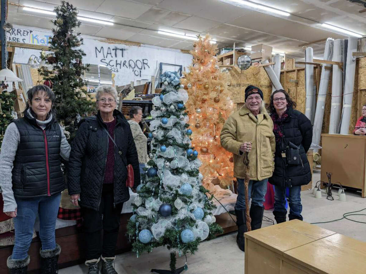 Bidders were very happy with the Christmas trees being auctioned off at Lake County Habitat for Humanity, giving them a chance to give back.