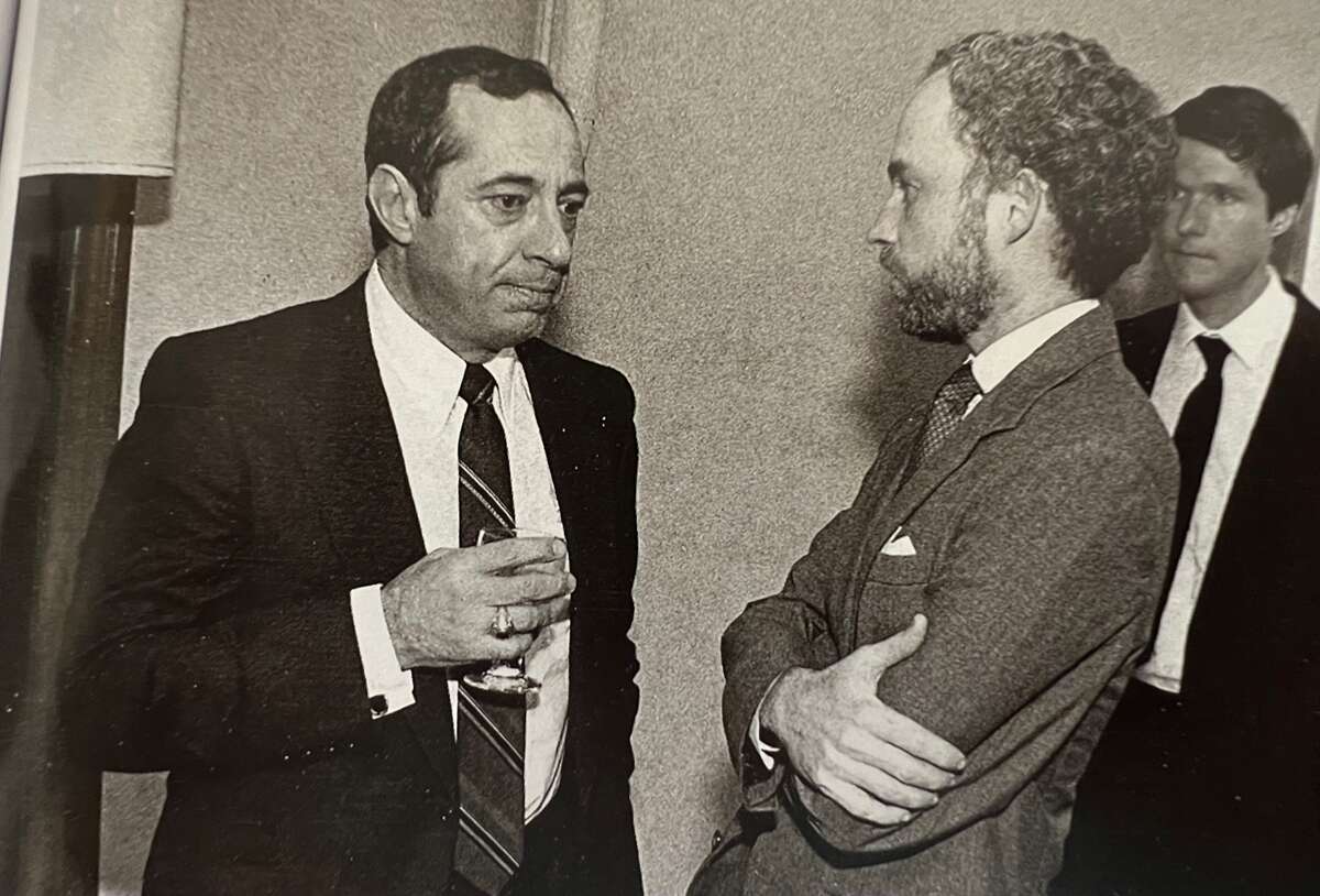 Gov. Mario Cuomo confers with his speechwriter, Peter Quinn, at the University of Notre Dame moments before he went on stage to deliver his acclaimed speech, “Religious Belief and Public Morality: A Catholic Governor’s Perspective” in September, 1984.  Although he never publicly gave Quinn credit, the governor signed this photo: “Peter: Thanks for the words…and the music. Mario.” 