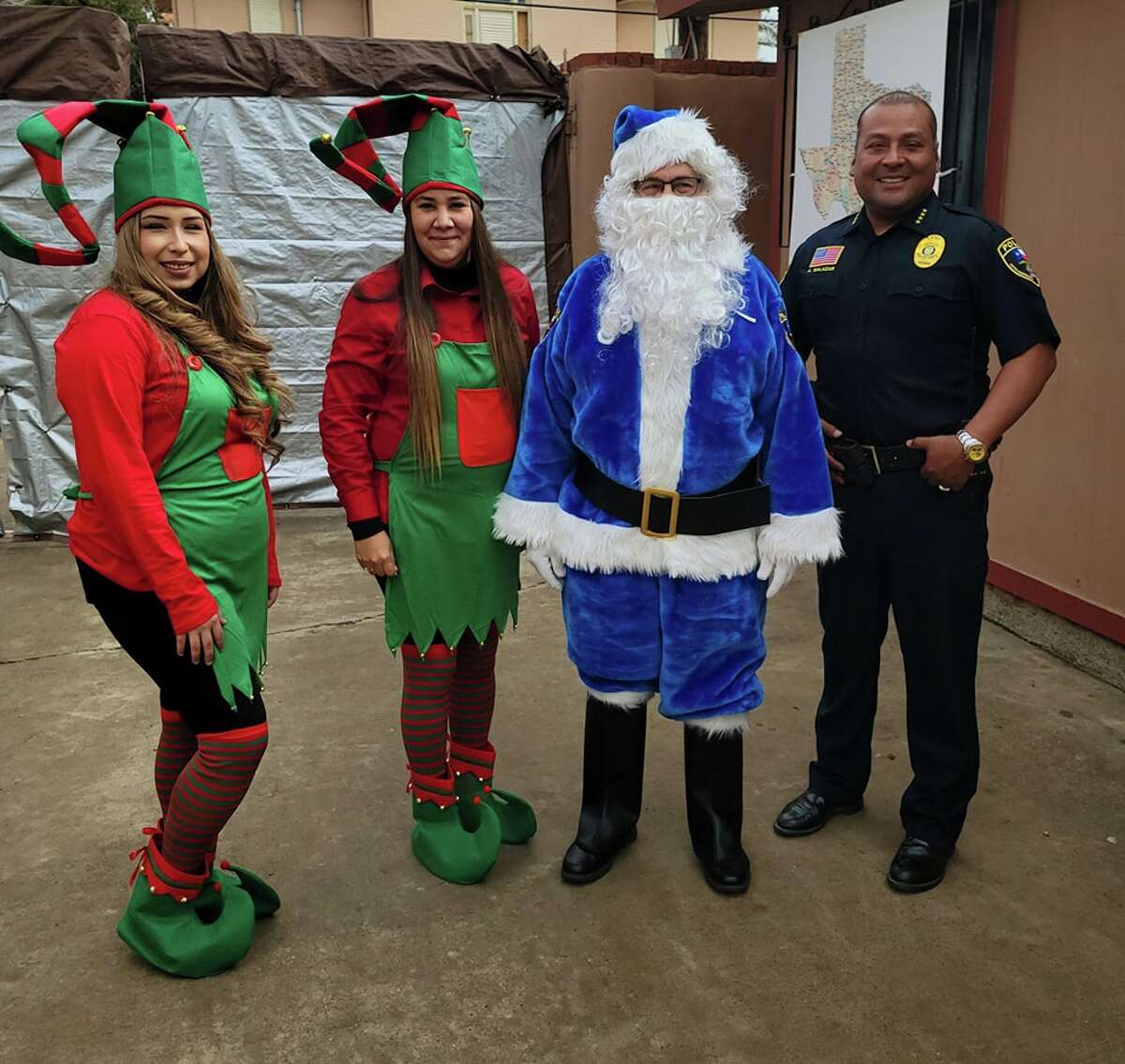 Blue Santa and his elves from the UISD Police Department visited the Holding Institute on Monday, December 19 to deliver gifts and clothing to the children.