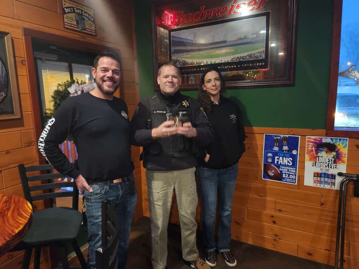 Pat (left) and Linda (right) Ringler presented Lake County Sheriff Rich Martin (center) with several $50 gift cards as a donation to the LCSO holiday gift card giveaway.