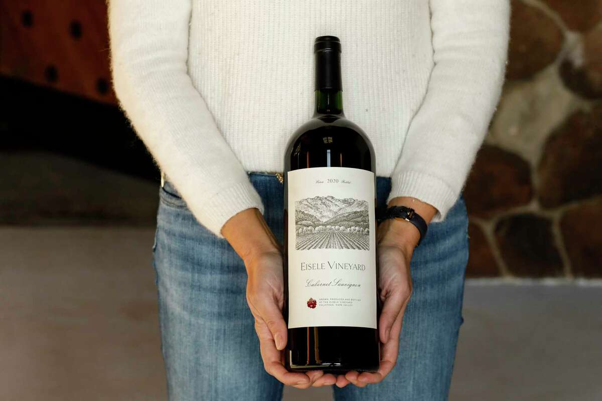 Winemaker Helene Mingot holds a bottle of 2020 Eisele Vineyard Cabernet Sauvignon. 