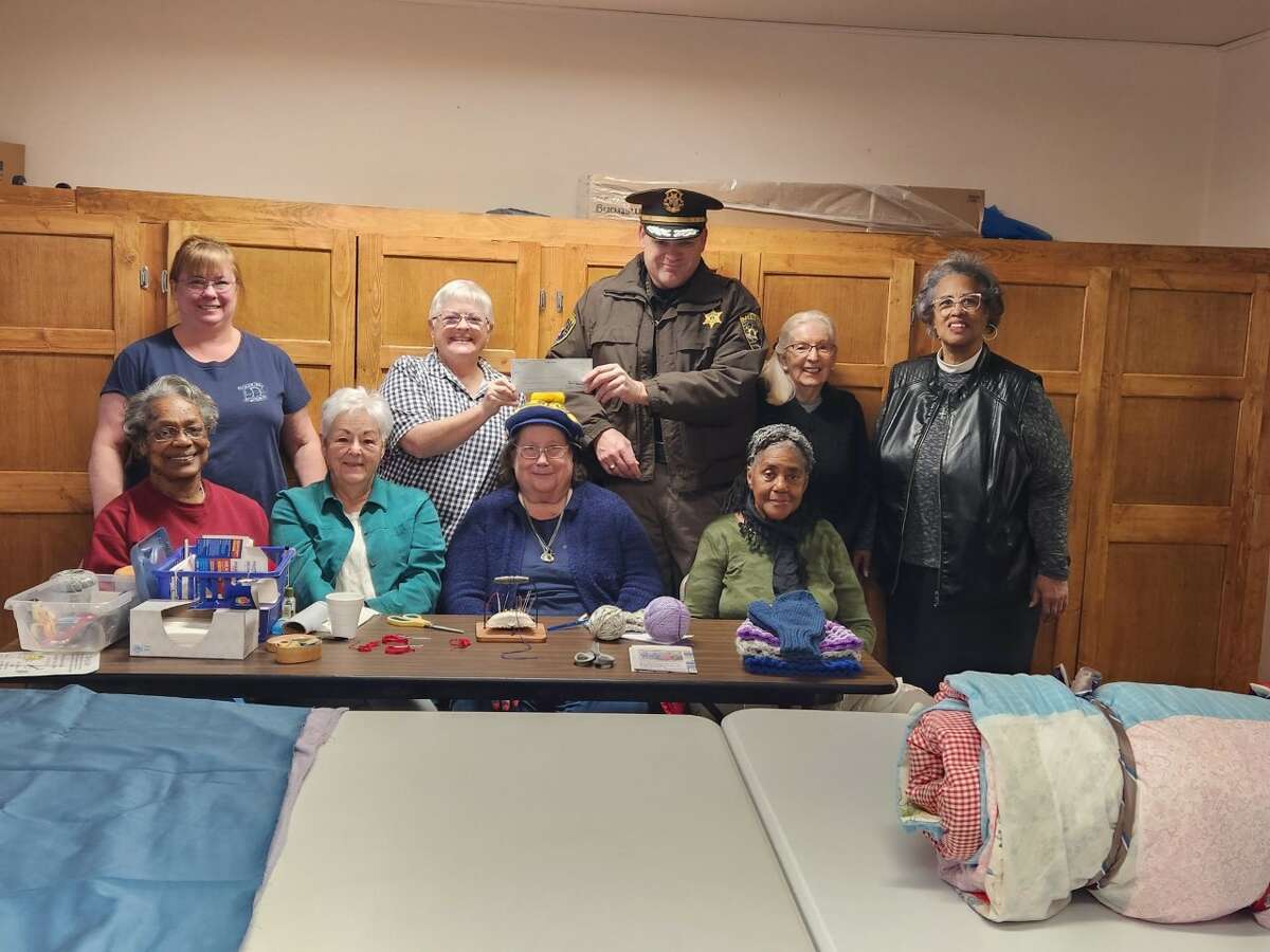 Lake County Sheriff Rich Martin (back, center) presented the Caring Quilts group of the Covenant United Methodist Church in Baldwin with a check for $500 from the ongoing LCSO Charitable Campaign.