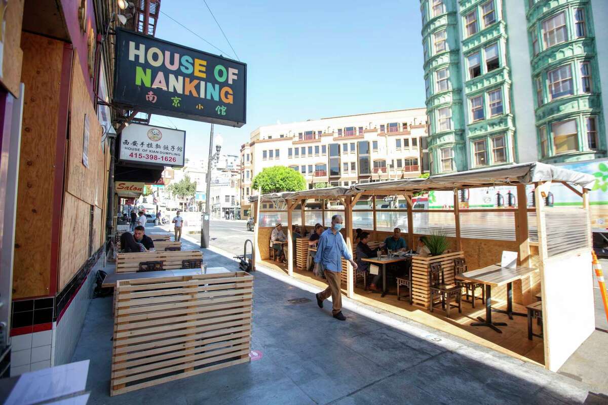 Guests enjoy lunch in the outdoor seating at House of Nanking restaurant, a Bay Area restaurant institution, in San Francisco, Calif. on Wednesday, Oct. 14, 2020.