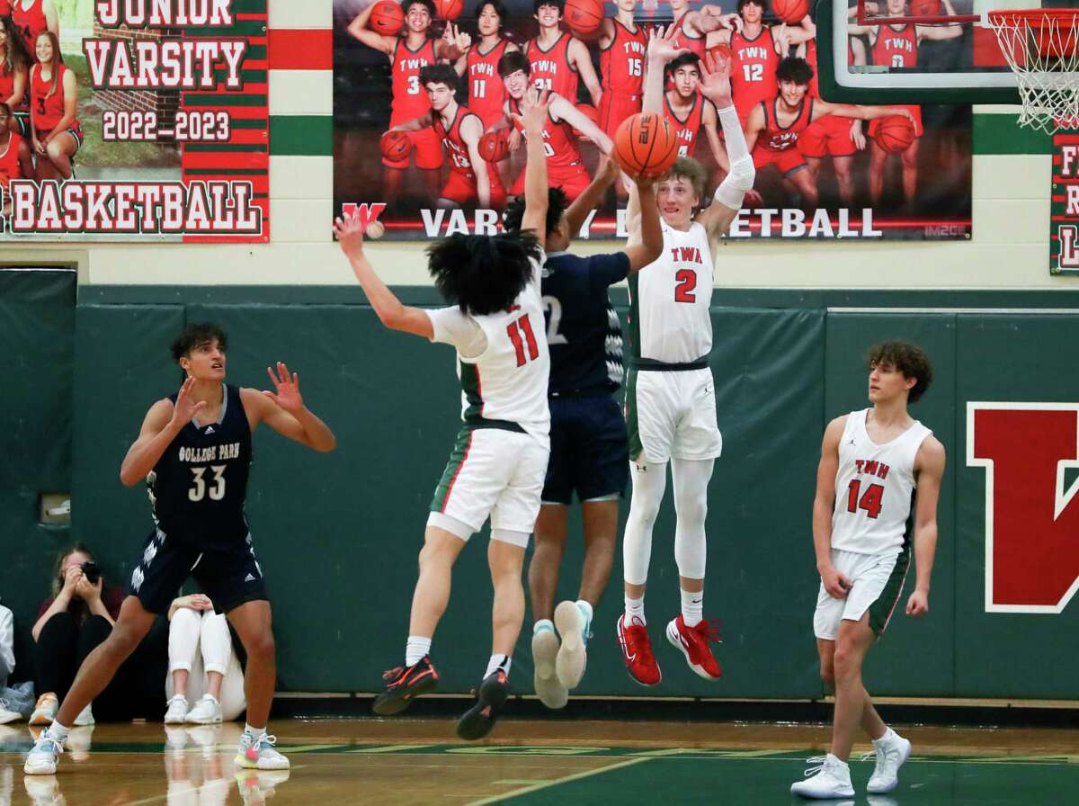 The Woodlands guards Shey Eberwein (2) and Lucas Hwang (11) pressure a shot by College Park guard Aiden Buckmon (2) during overtime of a District 13-6A high school basketball game at The Woodlands High School, Tuesday, Dec. 20, 2022, in The Woodlands.