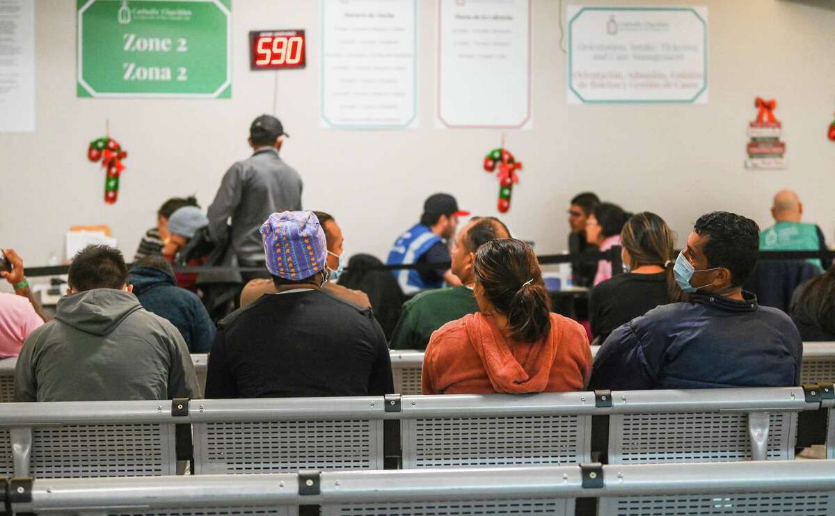 Migrants wait to be called in a waiting room at the City of San Antonio’s Migrant Resource Center, 7000 San Pedro Ave., on Tuesday. The center, which opened in July, is a stop for many migrants who have entered the United States at the Texas-Mexico border in hopes of gaining asylum. Most people receive nourishment, service referrals, a cot to sleep on before continuing their journey to other destinations.