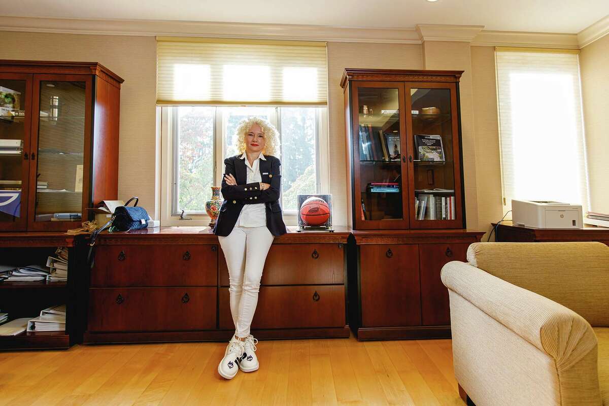 Flanked by a floral vase and a UConn Final Four basketball in her Storrs office, University of Connecticut President Radenka Maric brings worldly experience to an increasingly global job.
