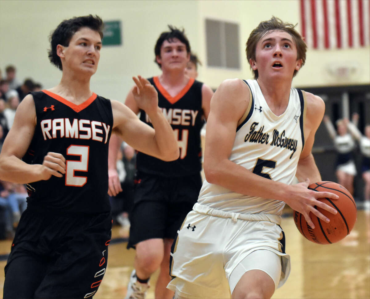 Father McGivney's Jacob Huber in transition against Ramsey during the first half of a non-conference game on Tuesday in Glen Carbon.